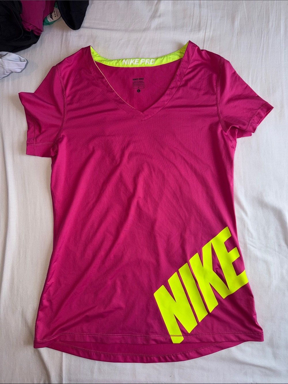 Nike Women's Pink V-Neck Tee with Neon Yellow NIKE Graphic